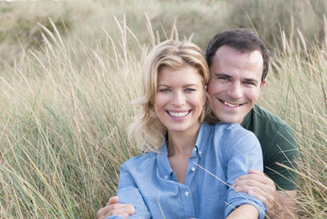 Portrait of mid adult couple in sandunes, Thurlestone, Devon, UK - CUF42810