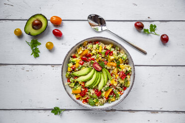 Bowl of bulgur salad with bell pepper, tomatoes, avocado, spring onion and parsley - SARF03828