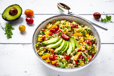 Bowl of bulgur salad with bell pepper, tomatoes, avocado, spring onion and parsley - SARF03829