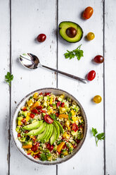 Bowl of bulgur salad with bell pepper, tomatoes, avocado, spring onion and parsley - SARF03830