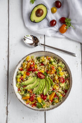 Bowl of bulgur salad with bell pepper, tomatoes, avocado, spring onion and parsley - SARF03833