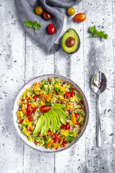 Bowl of bulgur salad with bell pepper, tomatoes, avocado, spring onion and parsley - SARF03834