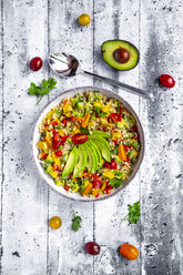 Bowl of bulgur salad with bell pepper, tomatoes, avocado, spring onion and parsley - SARF03835