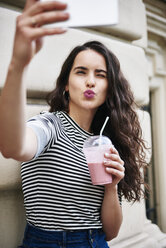 Young woman taking a selfie in the city - ABIF00680