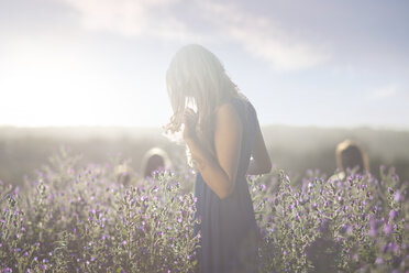 Girl standing on meadow - CUF43125