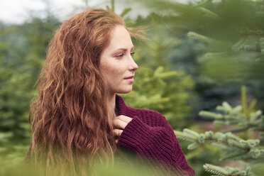 Portrait of redheaded young woman in nature - ABIF00707