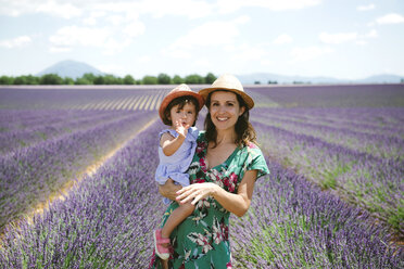 France, Provence, Valensole plateau, portrait of smiling mother and daughter in lavender fields in the summer - GEMF02144