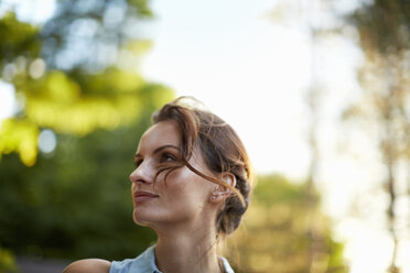 A young woman in the woods at dusk. - MINF00206