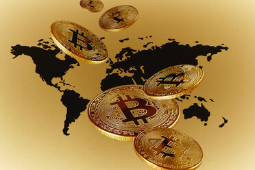 Goldene Bitcoins über der Weltkarte - CAIF21209