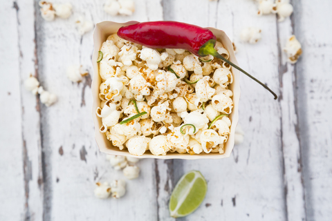 Box of popcorn flavoured with chili and lime stock photo