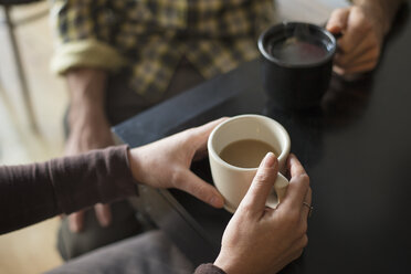 A coffee shop and cafe in High Falls called The Last Bite. Two people sitting holding coffee cups. - MINF00425