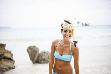 A young woman wearing snorkeling gear on the Samana Peninsula in the Dominican Republic. - MINF00707