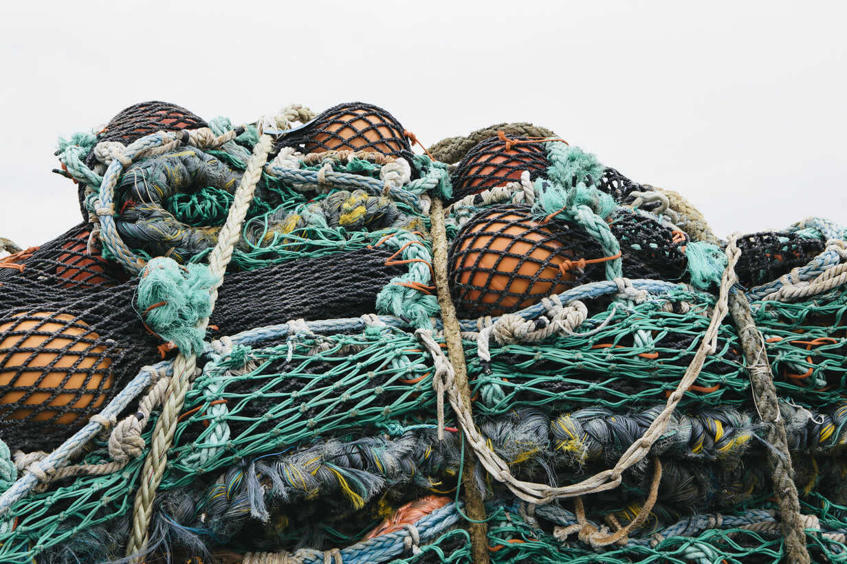 Pile of Fishing Nets with Floats and Colorful Ropes Stock Image