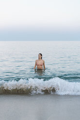 Beautiful woman at the beach, swimming in the sea - AFVF00849