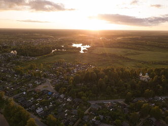 Russia, Leningrad Oblast, Aerial view of Tikhvin at sunset - KNTF01145