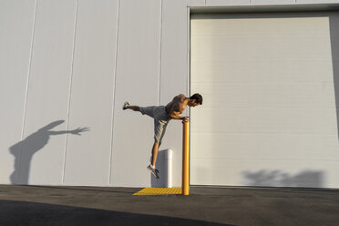 Acrobat training on pole - AFVF00978