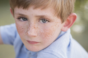 A young boy with freckles on his face. - MINF01489