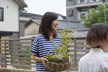 Two women standing in a garden. - MINF01745