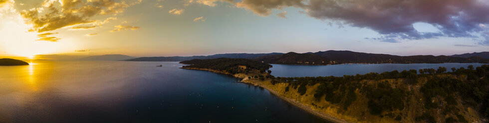 Greece, Aegean Sea, Pagasetic Gulf, Peninsula Pelion, Sound of Trikeri, Aerial view from Bay of Milina to Island Alatas with Holy Forty Monastery at sunset - AMF05870