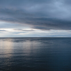 The sea and sky over Puget Sound in Washington, USA. The horizon with light cloud layers above. - MINF02119