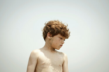 Bare-chested boy standing outdoors - ISF17027