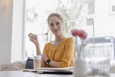 Young woman working in coworking space, taking a break - JOSF02323