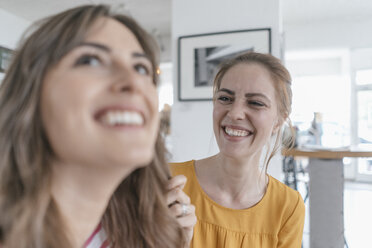 Two girlfriends meeting in a coffee shop, having fun - JOSF02384