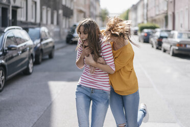 Two girlfriends having fun in the city, running - JOSF02402
