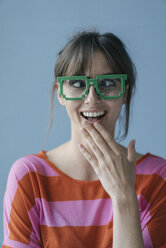 Young woman wearing pixel glasses, looking cross-eyed - JOSF02434