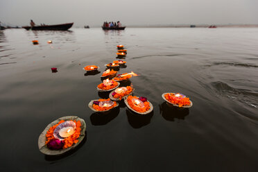 Candles floating in the Ganges River, Varanasi, India - MINF02166