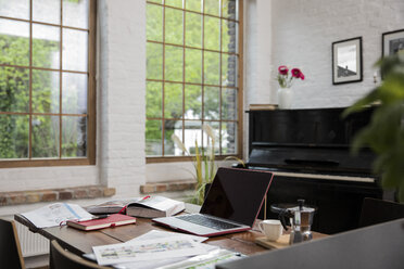 Home office with piano in background at comfortable loft apartment - FKF03037