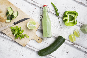 Glass bottle of homemade green Gazpacho and ingredients - LVF07331