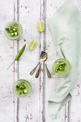 Three glasses of homemade green Gazpacho and ingredients - LVF07333