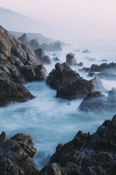 The Pacific Ocean coastline, with waves crashing against the shore. - MINF02375