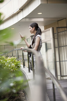 A woman on a walkway in Namba Park office and shopping complex. - MINF02560