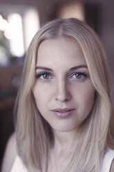 Portrait of young blond woman with blue eyes - KMKF00398