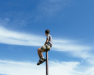 A Man Balancing on a Ladder · Free Stock Photo