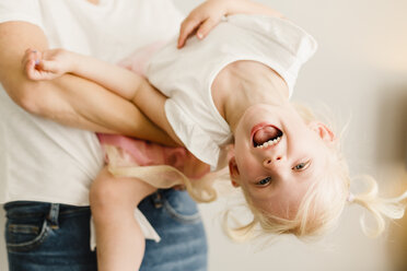 Portrait of happy little girl playing with her mother - NMSF00211