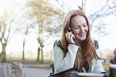 Woman talking on cell phone outdoors - ISF17186