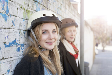 Women wearing bicycle helmets - ISF17194