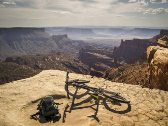 Dirt bike sitting on rocky overlook - ISF17316