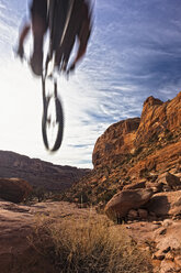 Blurred view of mountain biker in air - ISF17329