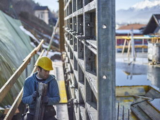 Construction worker working on plywood - CVF00992