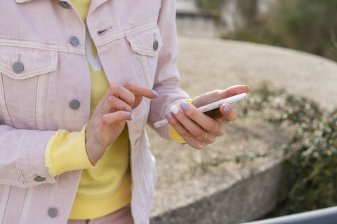 Young woman using smartphone stock photo