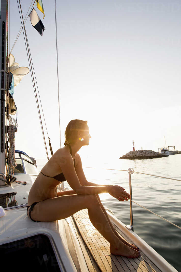 legs of a woman in a boat that takes off bikini Stock Photo - Alamy