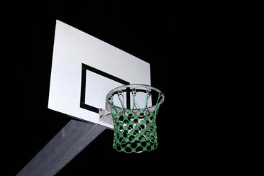 Basketball net illuminated at night - ISF17484