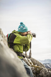 Hiker taking pictures in rural landscape - ISF17584