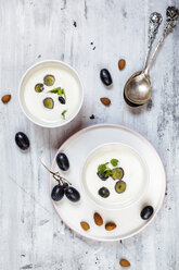 Ajo Blanco, white gazpacho, spanish cold soup, almonds and blue grapes, overhead view - SBDF03705