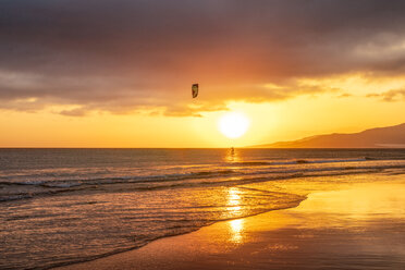 Spain, Andalucia, Tarifa, kite surfer at sunset - SMAF01069