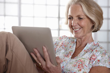 Older woman using tablet computer - ISF17864